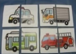 パトカーや消防車のイラストが２つに分かれており、それを並べてひとつの絵にする教具のイメージ
